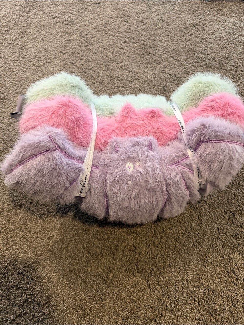 cupcakes & cashmere Pastel Fuzzy bat pillows in Pink, Lavender & Mint